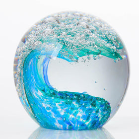 Qianwei ocean waves crystal ball glows with color, ideal as a decorative paperweight.