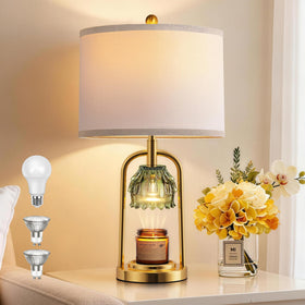 QiMH candle warmer lamp in brushed gold adds warm ambience to any space.