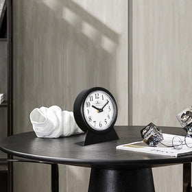 QIYAODECO black finish desk clock on desk in a living room setting
