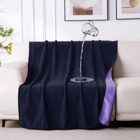 QiyI waterproof blanket on a bed in dark purple protects against spills.