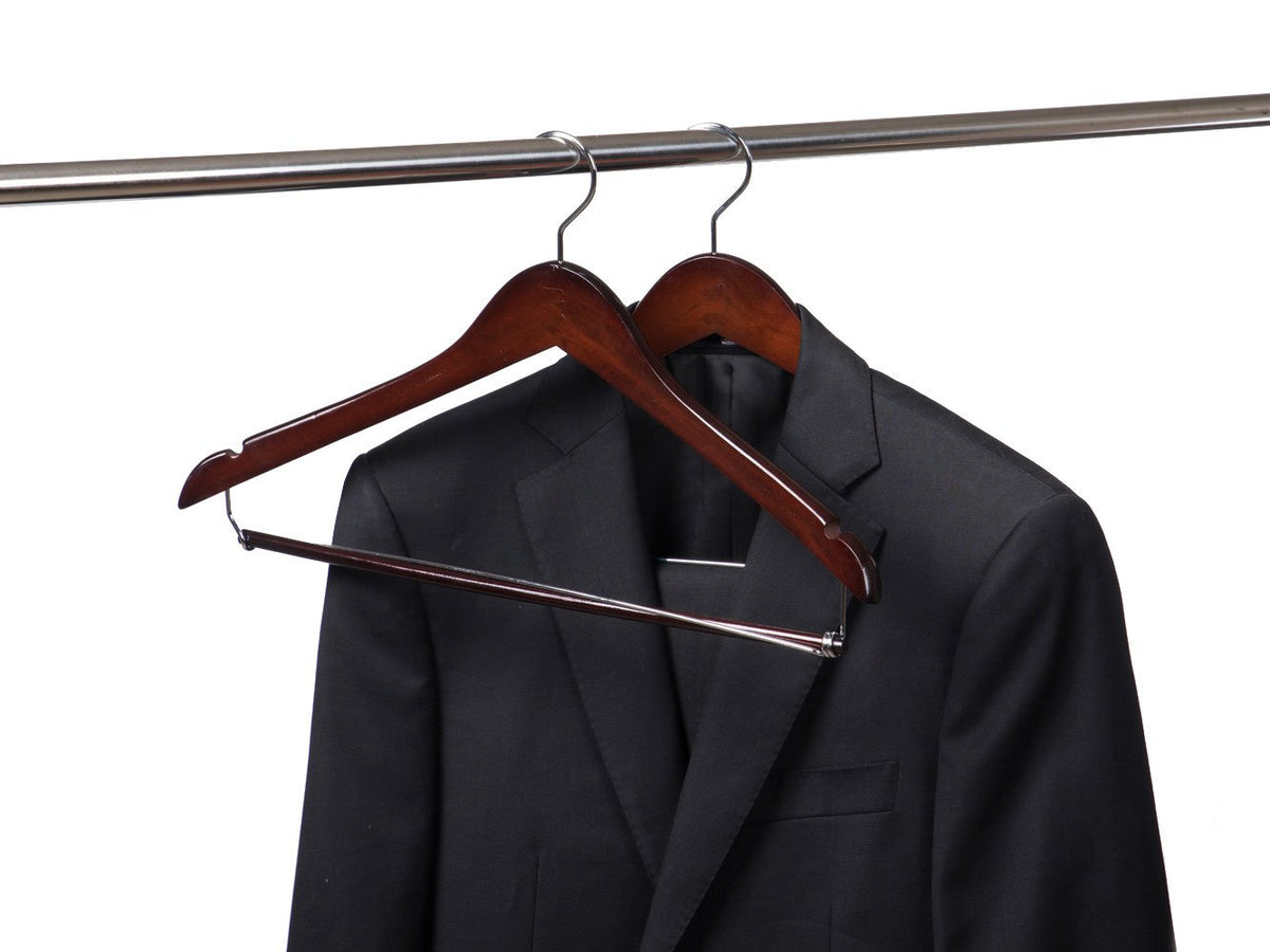 Quality Hangers curved hanger with shoulder notches for strap garments.