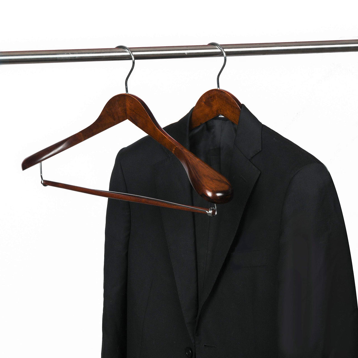 Quality Hangers locking bar wooden hanger keeps trousers aligned with jackets.