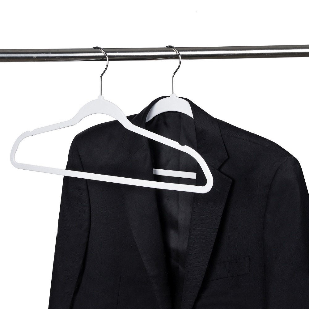 Quality Hangers cream white plastic blend with any closet decor.