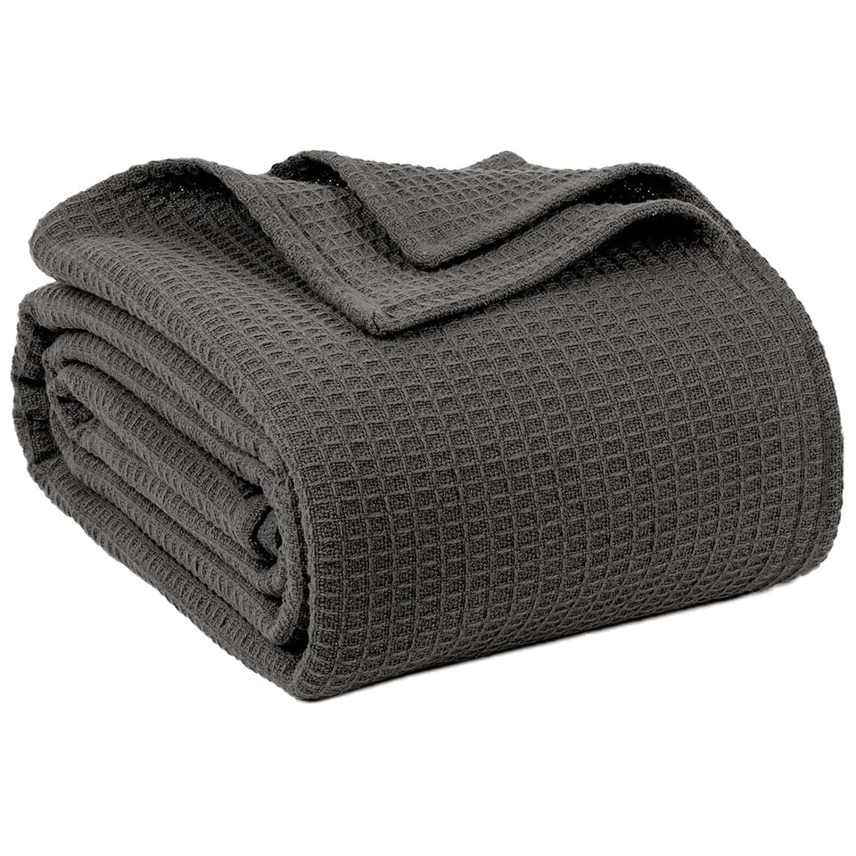 QUBA LINEN waffle-weave blanket on twin bed; soft and breathable.