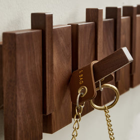QUELLANCE piano-keys design rack in hallway for quick access.