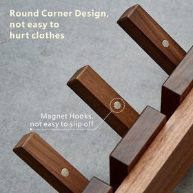 QUELLANCE four-hook wall rack mounted for coats and bags.