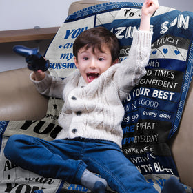 Quilazy Gifts for Son Blanket in a travel bag demonstrates easy portability