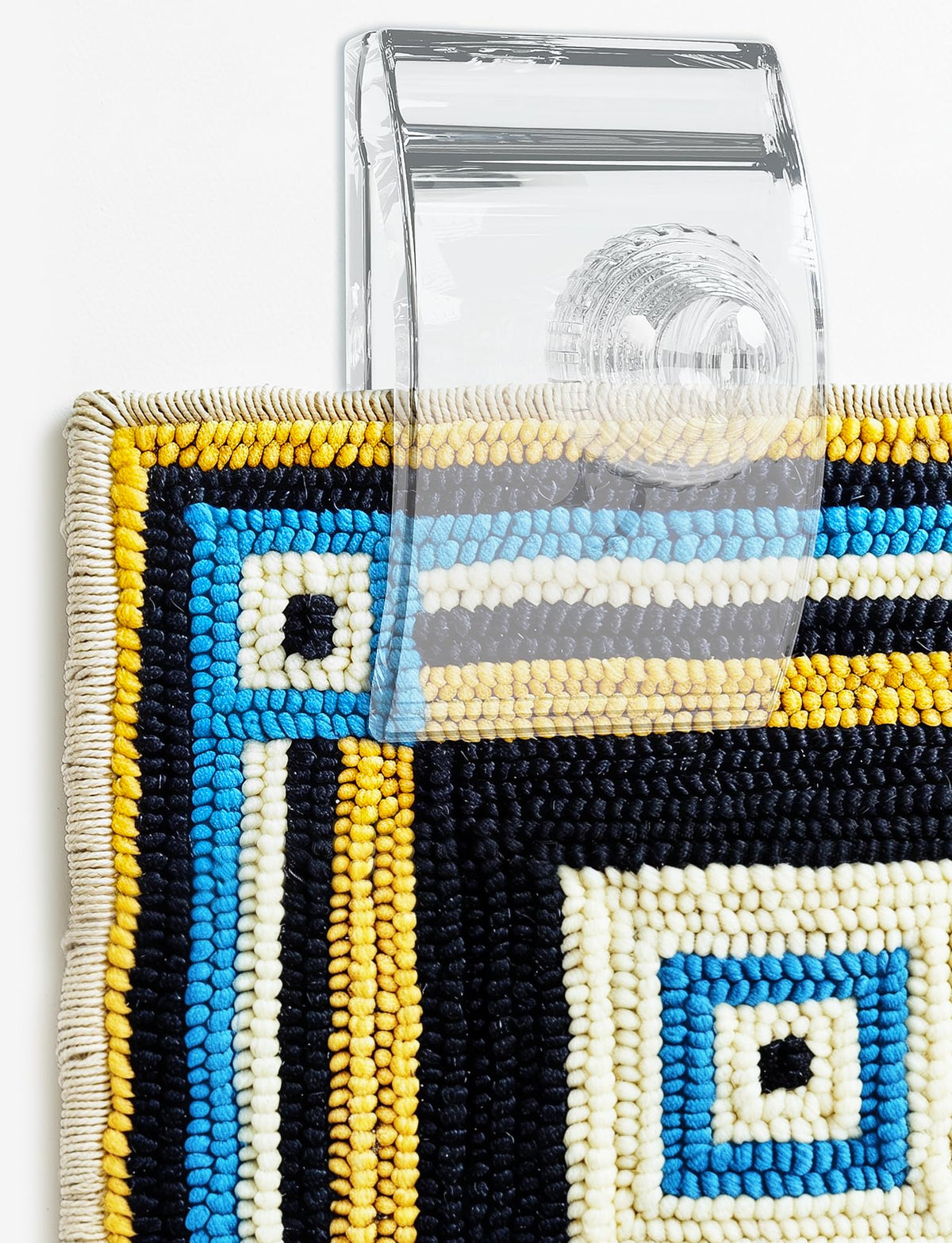 Quiltera clear wall clip showcasing tapestries without obstructing design