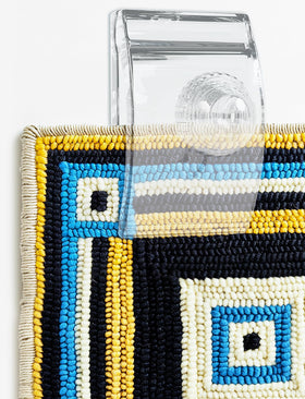 Quiltera clear wall clip showcasing tapestries without obstructing design