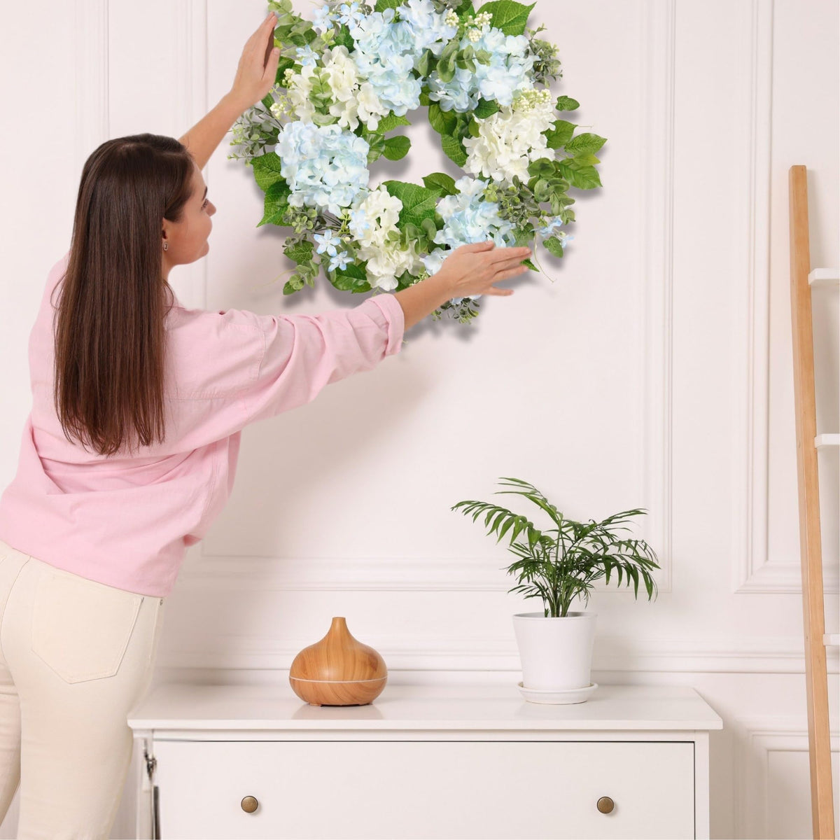 Quixem front-door decor in pastel blues and greens creates inviting spring curb appeal.