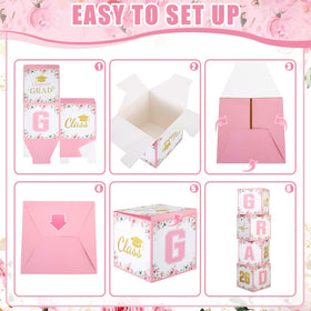 Qunclay pink gold graduation balloon box serves as a cake-table center decoration.