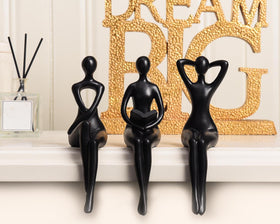 Quoowiit Black Thinker Statue on a shelf enhances display aesthetics.