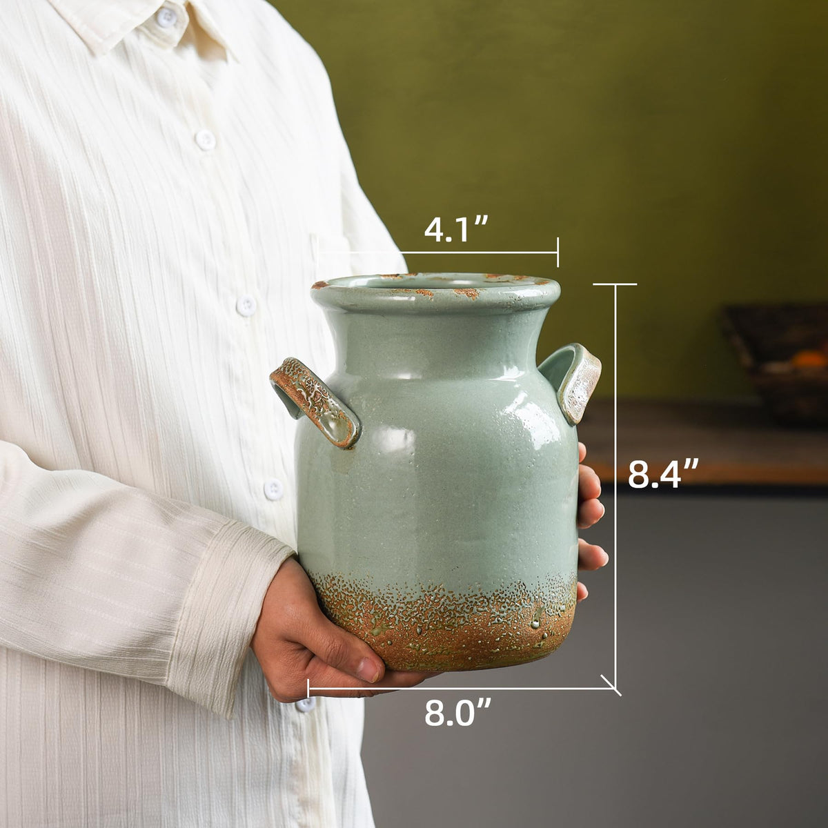 Quoowiit vase on a shelf creates a focal point in the space