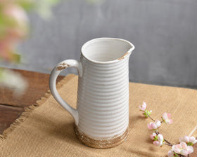Quoowiit farmhouse centerpiece vase enhances dining table with rustic style.