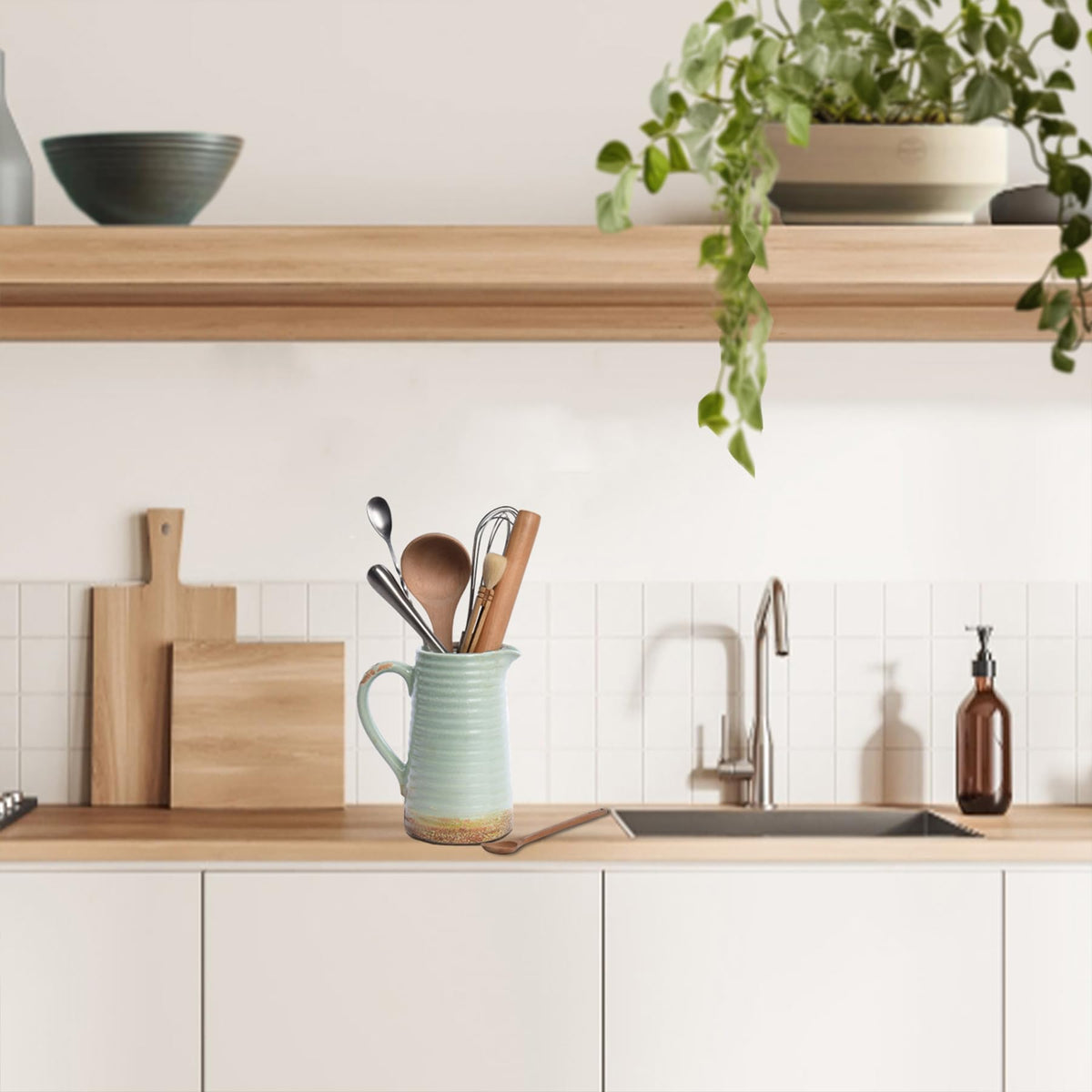 Quoowiit ceramic vase with handle easily moved for seasonal decor changes.