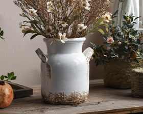 Quoowiit top-opening vase accommodates a lush bloom arrangement.