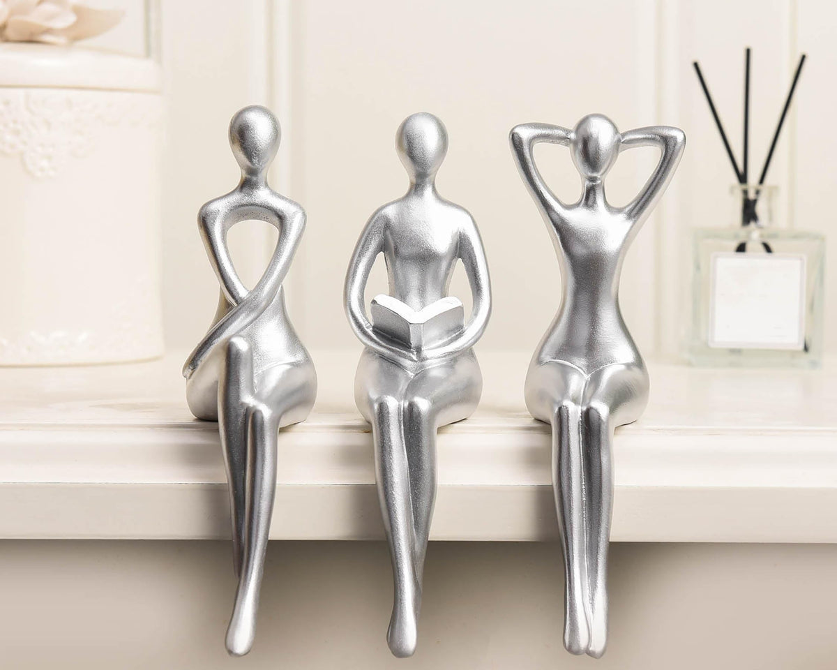 Quoowiit Thinker Statue with silver textured surface adds contemporary shelf appeal.