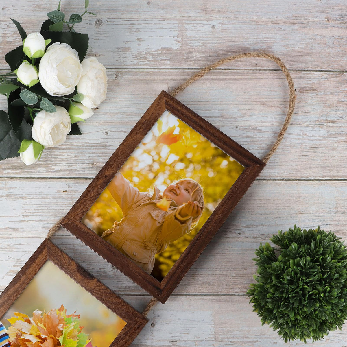 QUTREY wall decor featuring a neat, organized photo display