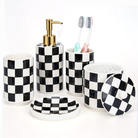 Quuavio ceramic soap dispenser with pump on checkered vanity for organized sink.