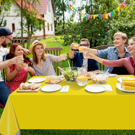 Ragnhild yellow tablecloth enhances a birthday party setup with vibrant color.