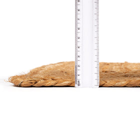 Ramanta Home natural fiber rug guards floors while adding soft, earthy elegance.