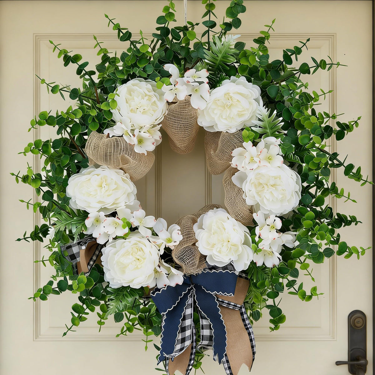 Ramblion 24-inch wreath on front door with peonies and eucalyptus for curb appeal.