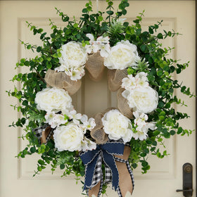 Ramblion 24-inch wreath on front door with peonies and eucalyptus for curb appeal.