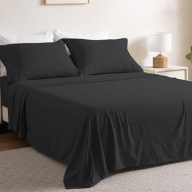 Ranunculus 4-piece queen flat sheet in black shows soft, breathable microfiber.