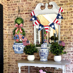 RattanView chinoiserie bonsai wreath adds elegance to any doorway.
