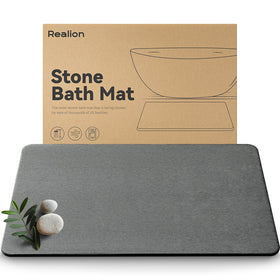 Realion Stone Bath Mat shows quick-drying diatomaceous earth for bathroom moisture control.