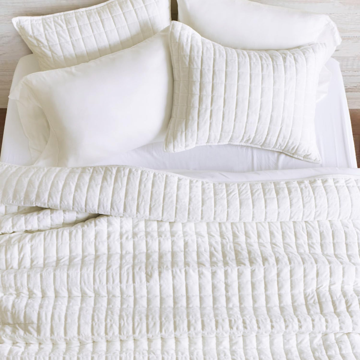 RECYCO channel stitch geometric pattern demonstrates durable quilting that prevents shifting.