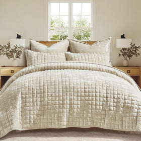 RECYCO velvet quilt beige bedroom shot enhances cozy ambiance.