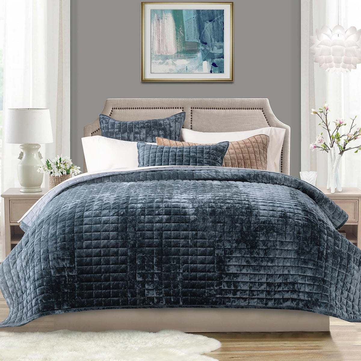 RECYCO velvet quilt set in stormy blue draped on a king bed for all-season elegance.
