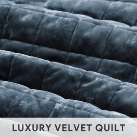 Stormy blue RECYCO quilt brightening a modern bedroom setting.