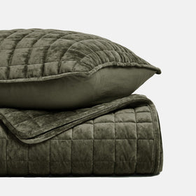 RECYCO velvet bedspread draped to floor for oversized look.