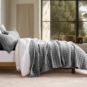 RECYCO velvet quilt closeup highlights plush texture and rich color shifts under light.