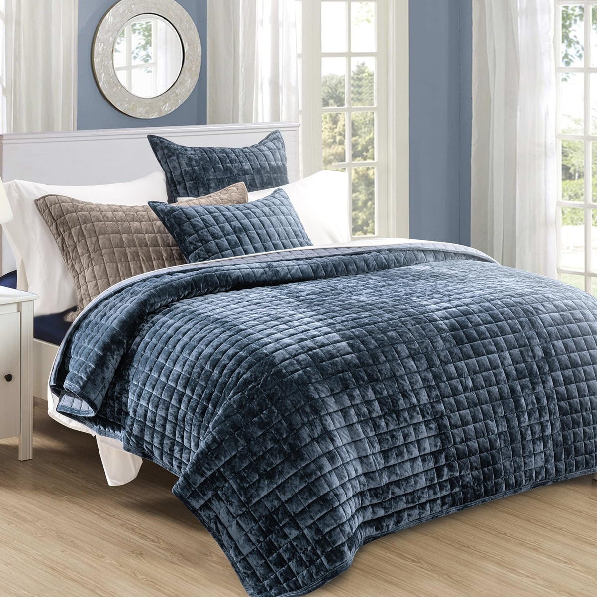 Close-up of RECYCO channel stitch on velvet quilt highlighting durable construction.