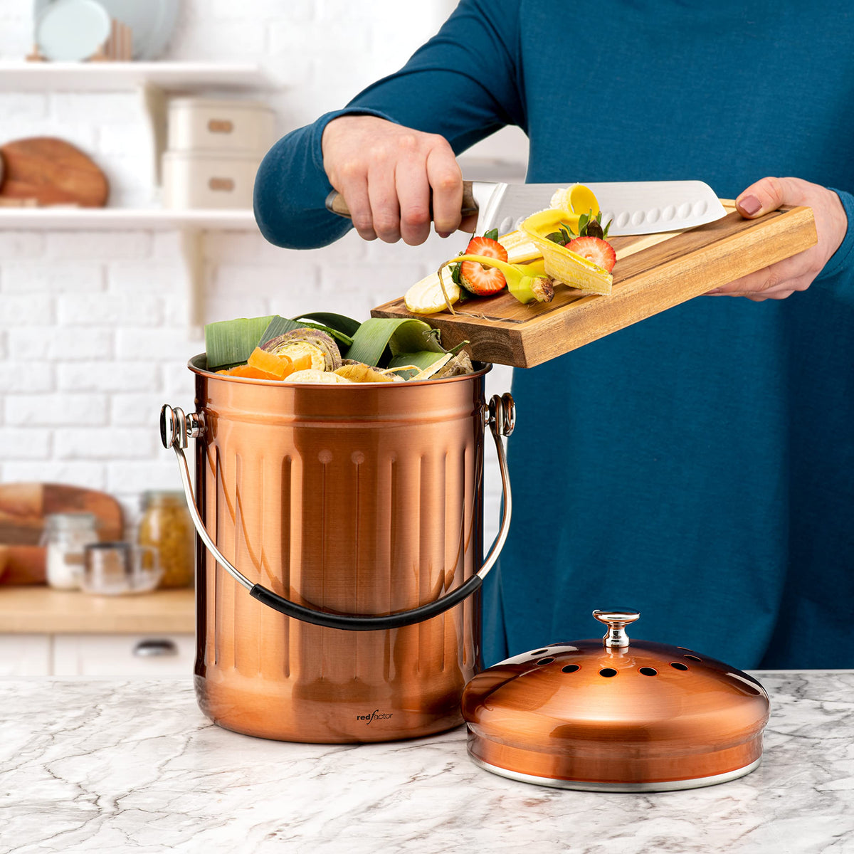 Red Factor compost bin features odor-control dual filters to neutralize smells during meal prep.