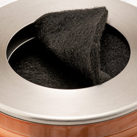 Elegant countertop appeal complements modern kitchens while keeping scraps handy.
