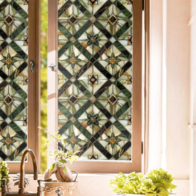 REDAMANCY boho golden geometric window film full panel offers privacy and a warm glow.
