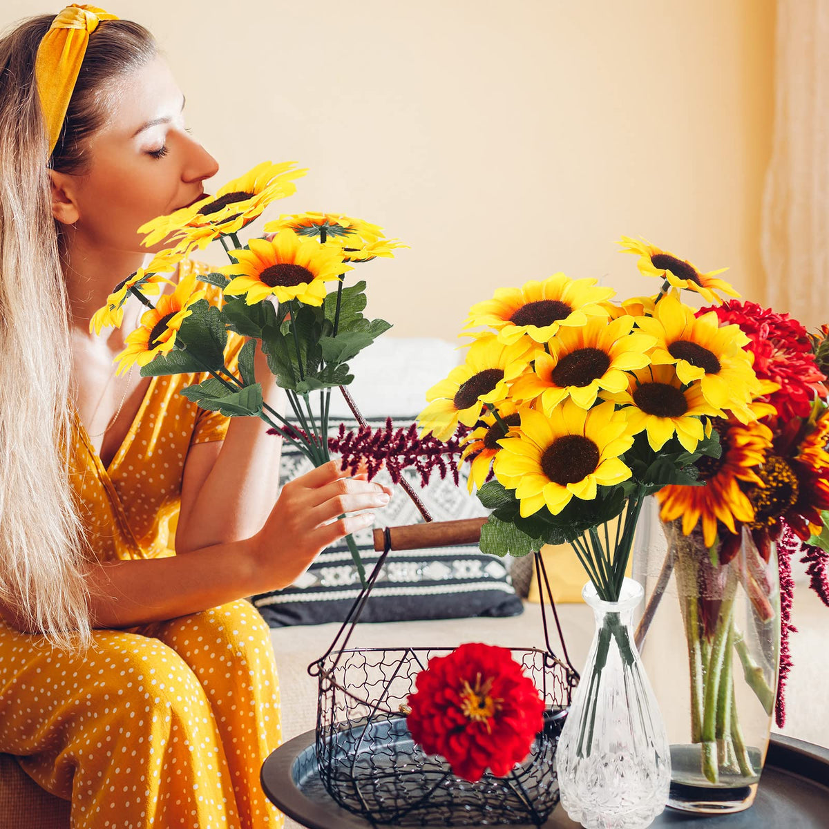 Redbaker faux sunflowers arranged in a patio display creating warmth.