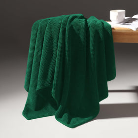 REDKISS towels in multiple settings show gym, bathroom, spa versatility