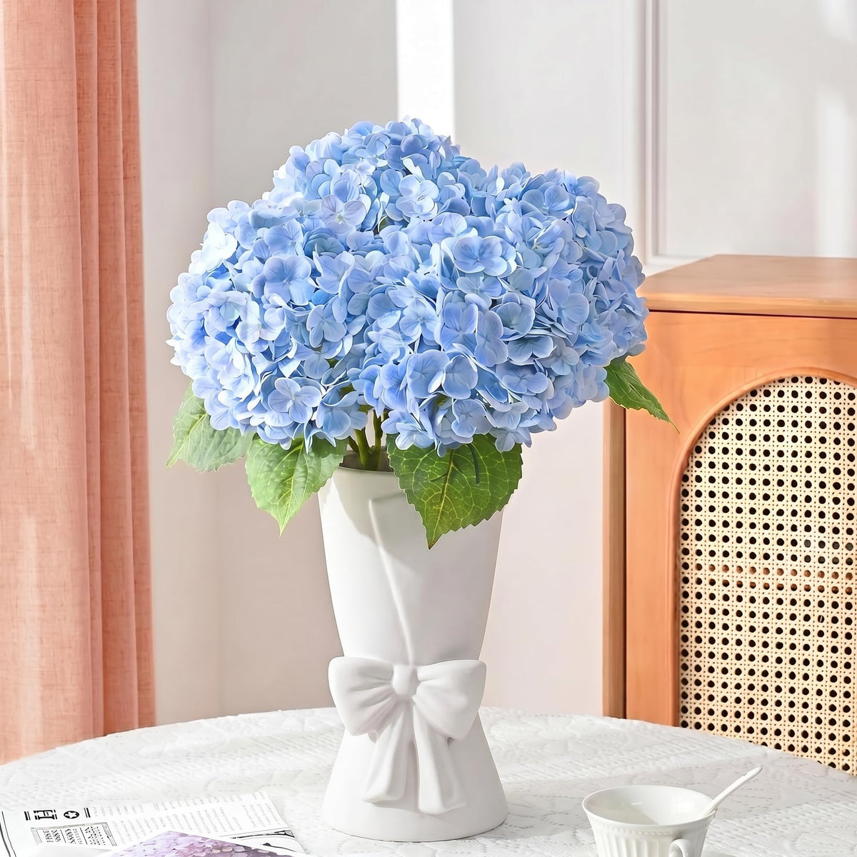 Relexome bow vase on table as a versatile centerpiece.