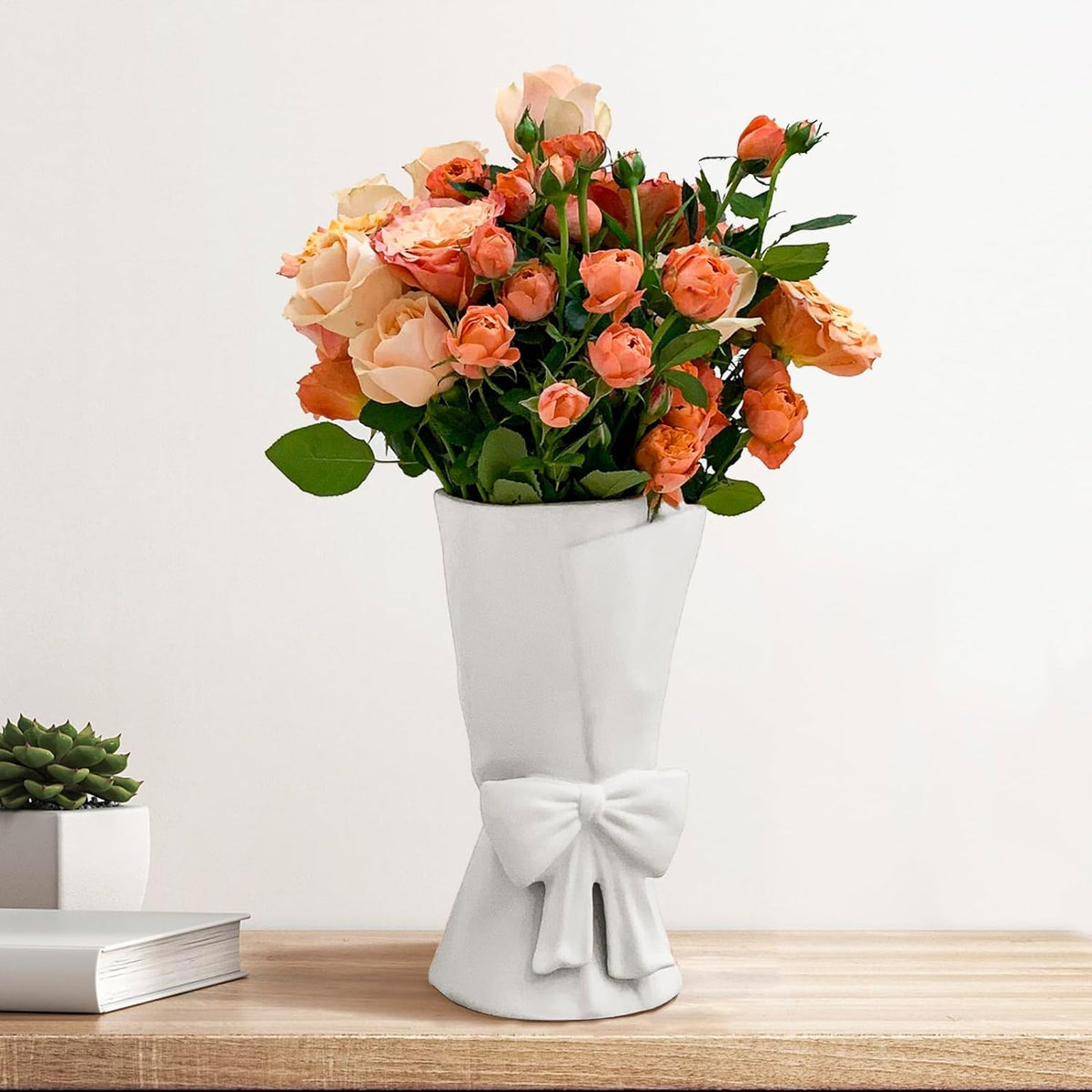 Relexome white ceramic bow vase front view, ideal for fresh or dried arrangements.
