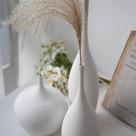 Relexome minimalist vases catching natural light reflections