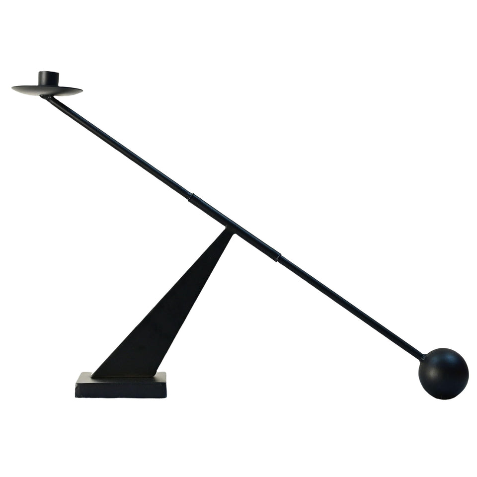 Remenna black metal candle holder with sleek design for modern table decor.