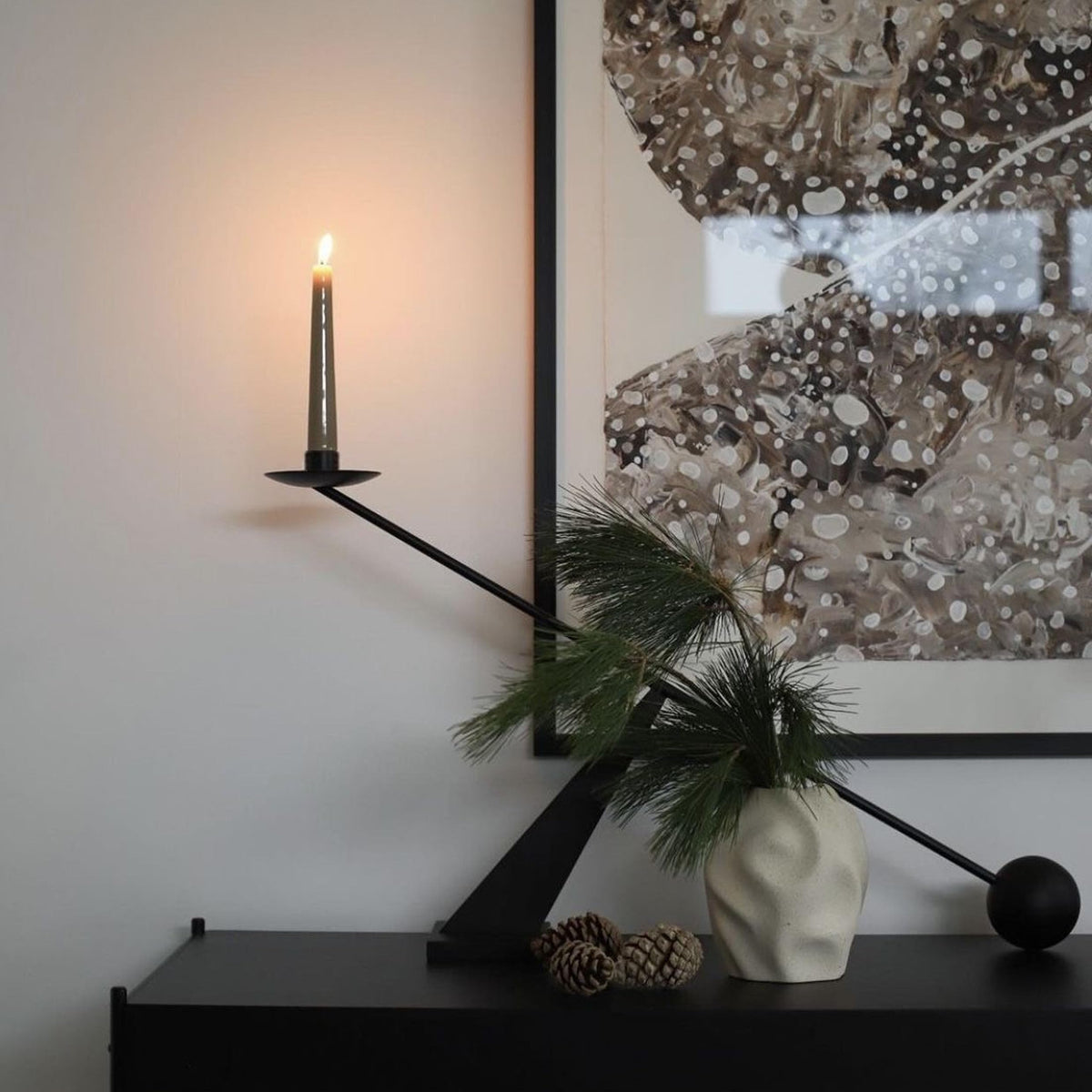 Remenna nineteen-inch height candle holder creates a striking focal point.