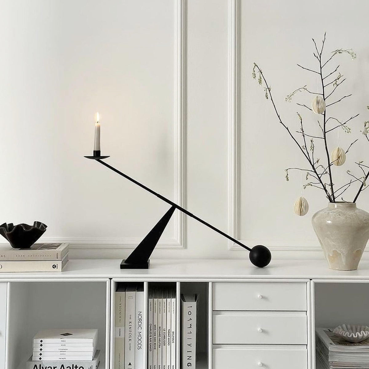 Remenna tapered candle holder design adds geometric elegance to any shelf.
