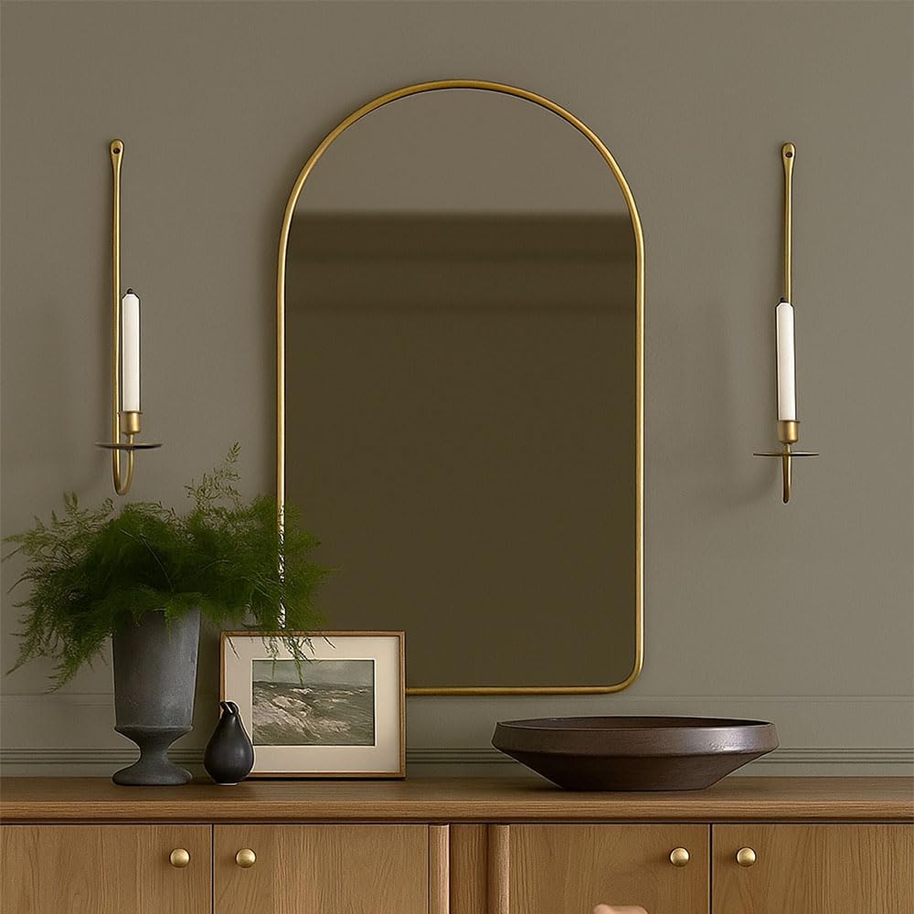 Living room setup featuring a Remenna wrought iron sconce casting warm candlelight.