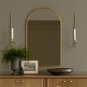 Living room setup featuring a Remenna wrought iron sconce casting warm candlelight.